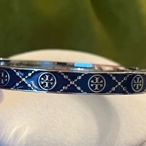 Tory Burch Icon T Monogram Hinge Bracelet in silver-tone metal and BLUE enamel.